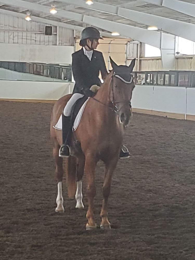 Chloe riding Barbie Doll